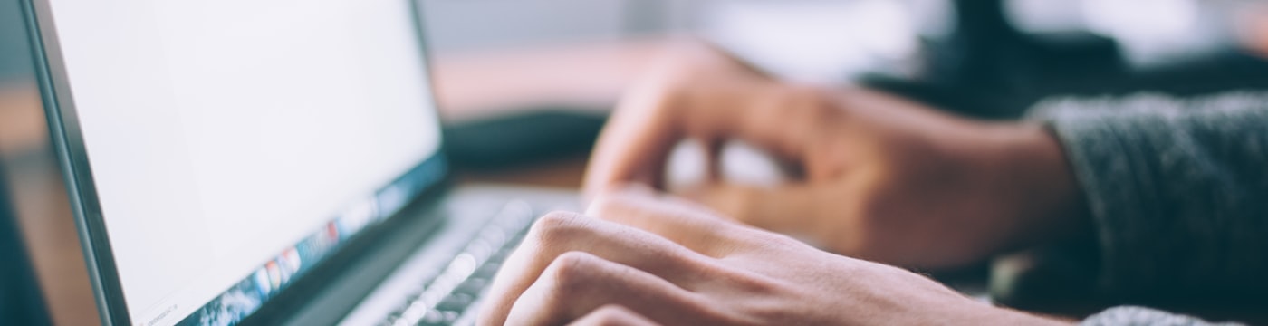 Laptop and notebook in soft light, suggesting flexible thinking