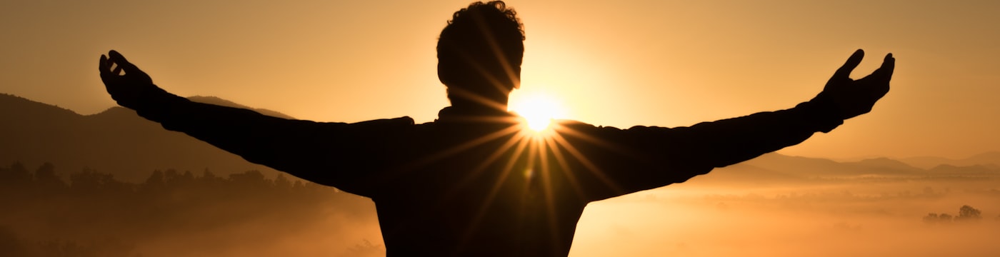 Person reflecting in quiet light, suggesting inner and future self