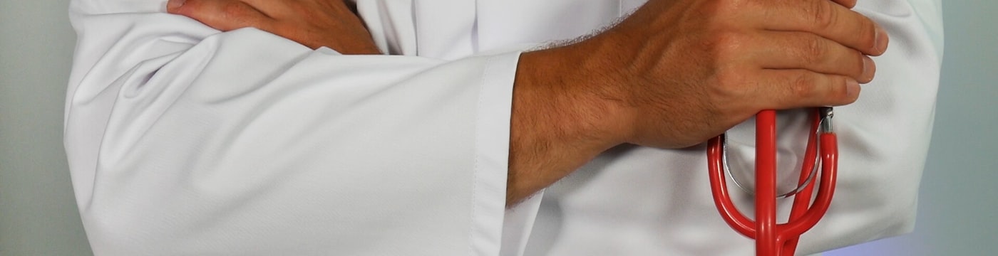 A stethoscope on a quiet desk, suggesting medical and health concerns