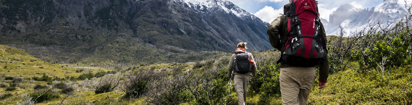 Climber reaching a summit, suggesting striving and aspiration